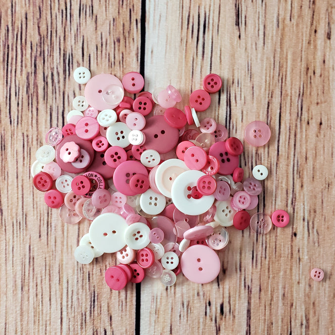 Boutons roses et blancs en plastique